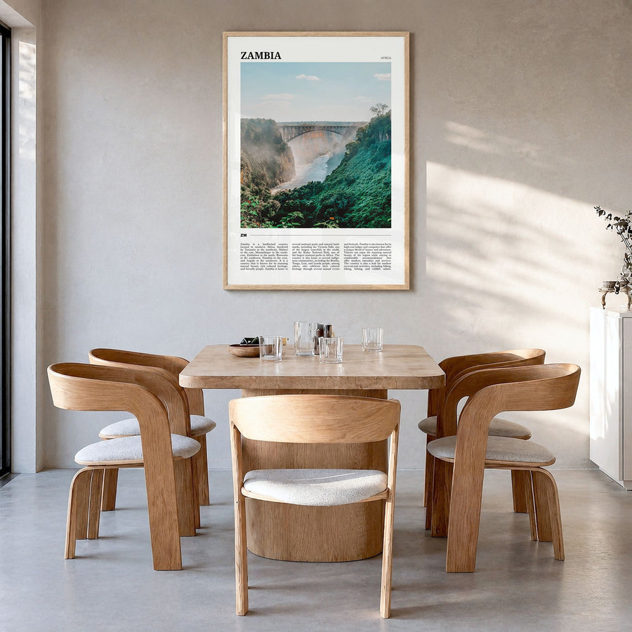 Zambia Travel Poster in a natural wood frame, hanging in a dining room