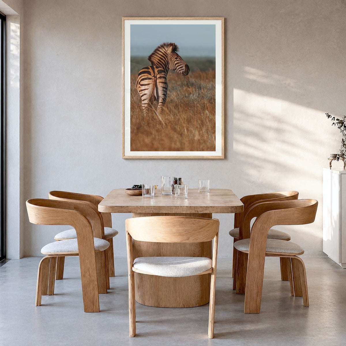 Zebra Photo No 2 Poster in a natural wood frame, hanging in a dining room, white border