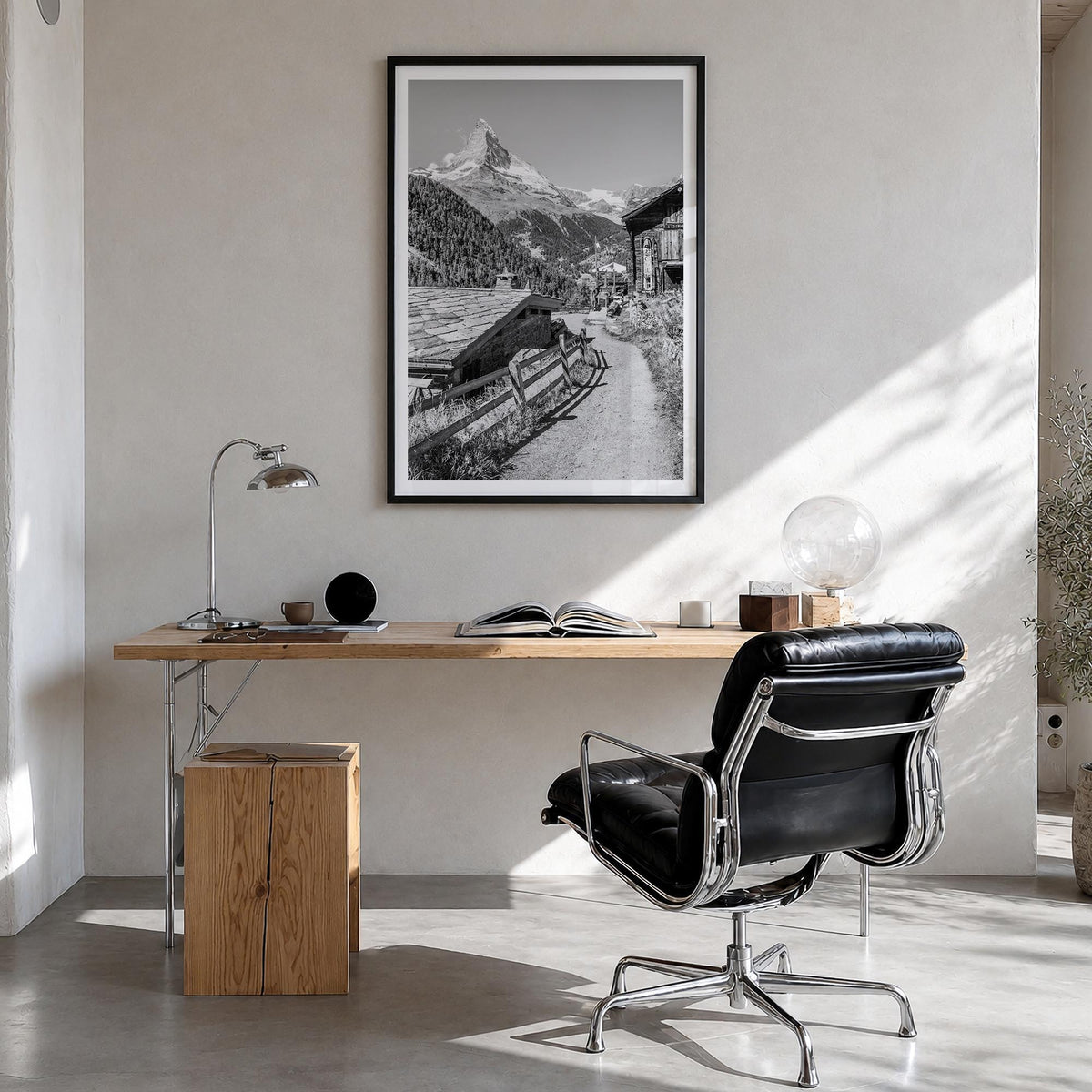 Zermatt black & white photo poster of Switzerland – vertical wall art in black wood frame with white border, hanging on wall