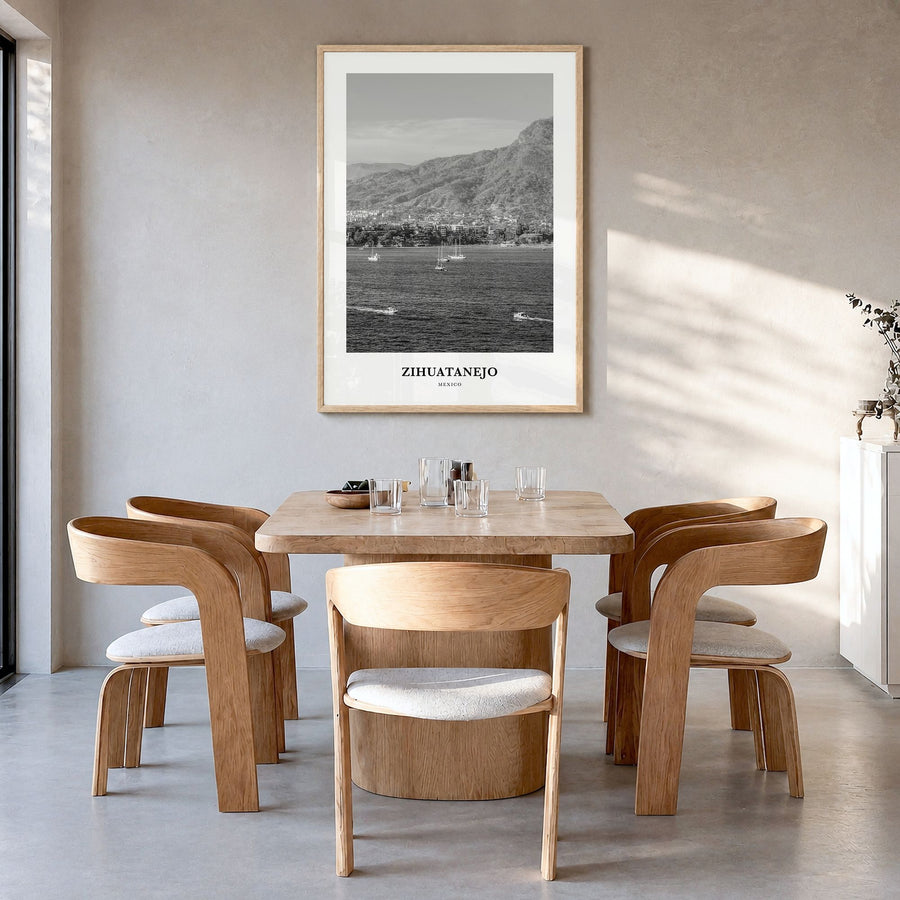 Zihuatanejo Classic Poster in a natural wood frame, hanging in a dining room