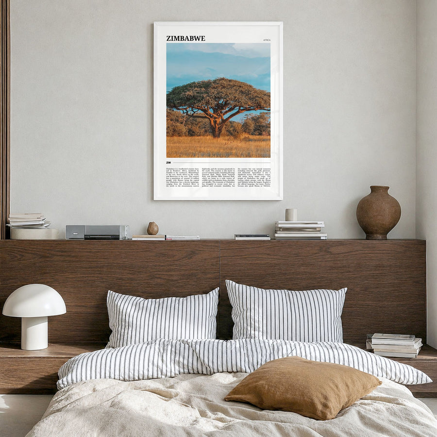 Zimbabwe Travel Poster in a white wood frame, hanging in a bedroom